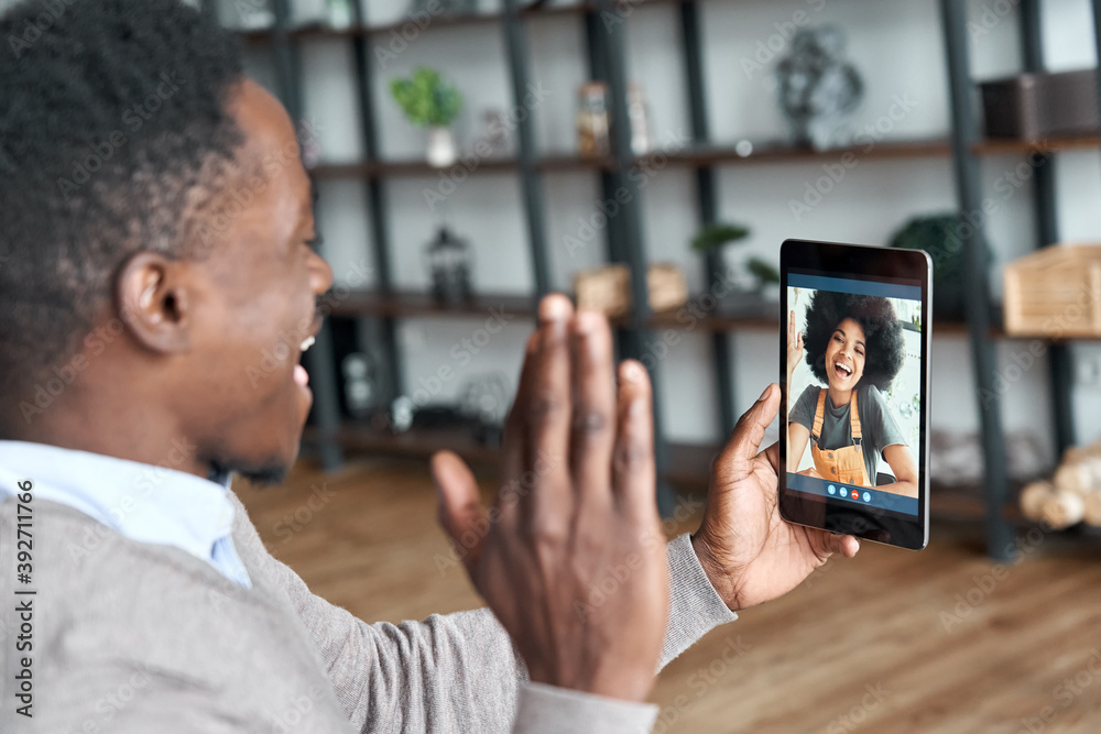 Happy african man waving hand video calling girlfriend on Zepeel.