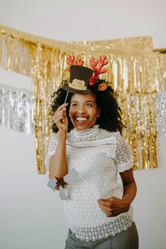 Happy woman holding a prop on Zepeel during a video chat date