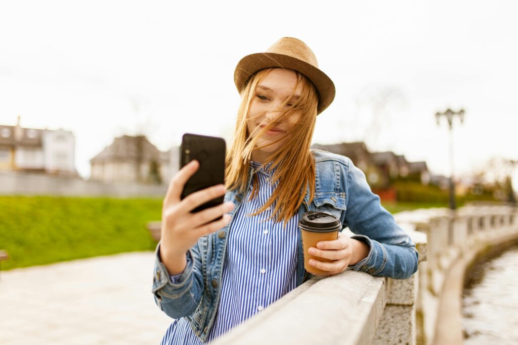 Woman holding cup while recording a video message for Zepeel in Europe