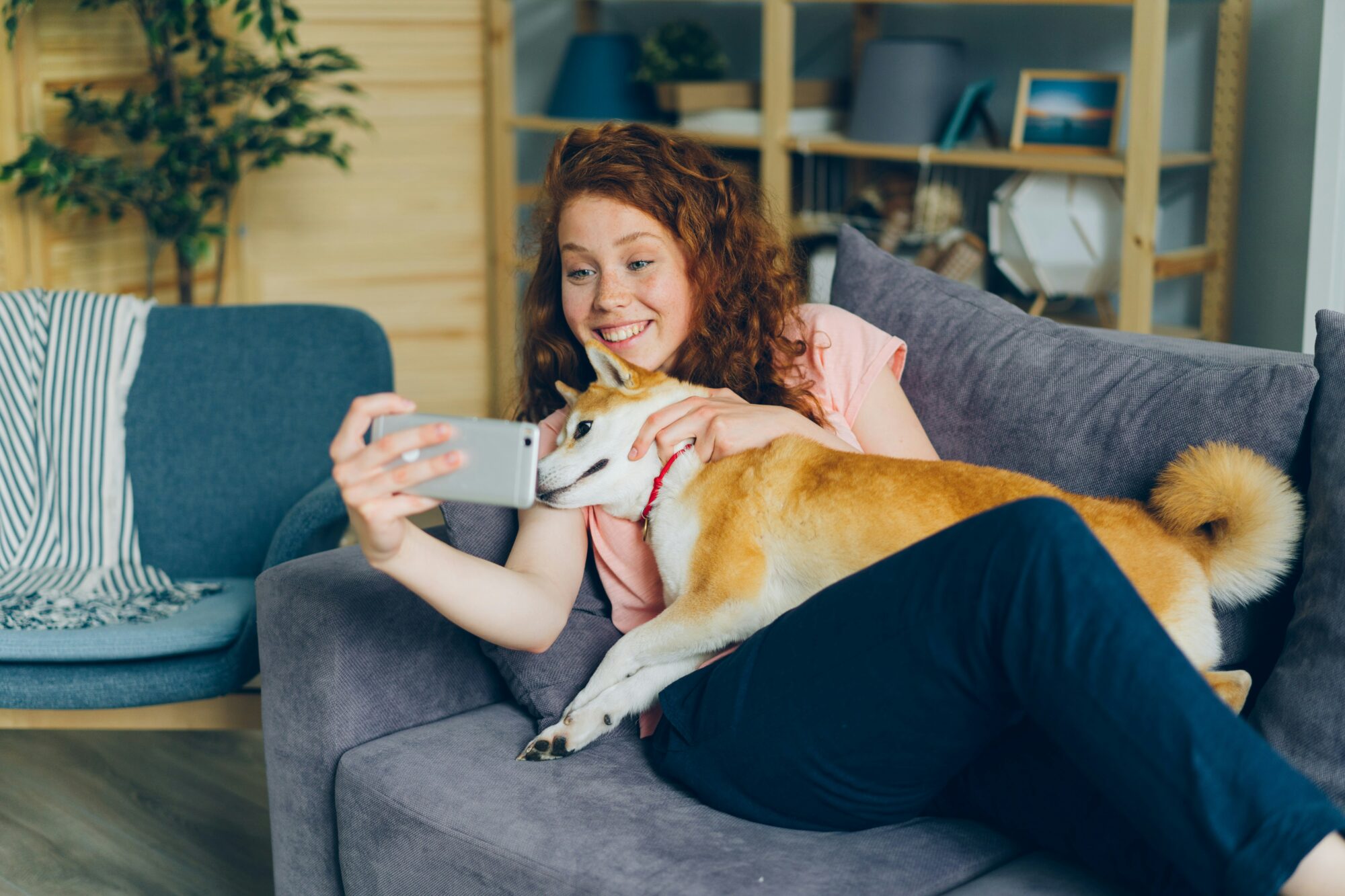 dog owner taking video message with pet smiling using zepeel