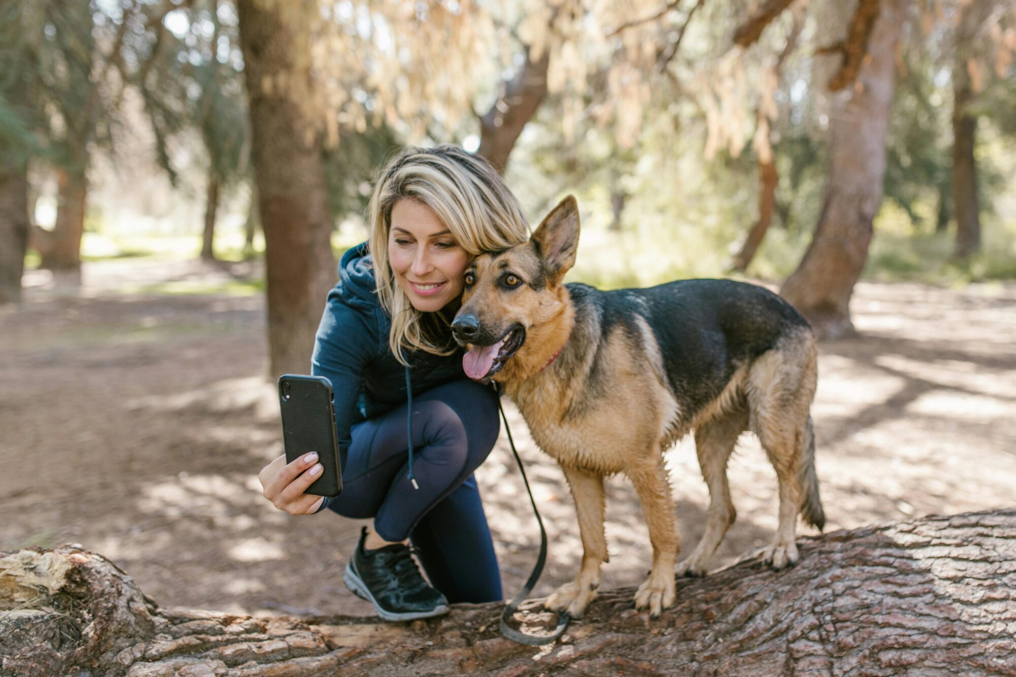 A woman recording a video message on Zepeel with her dog