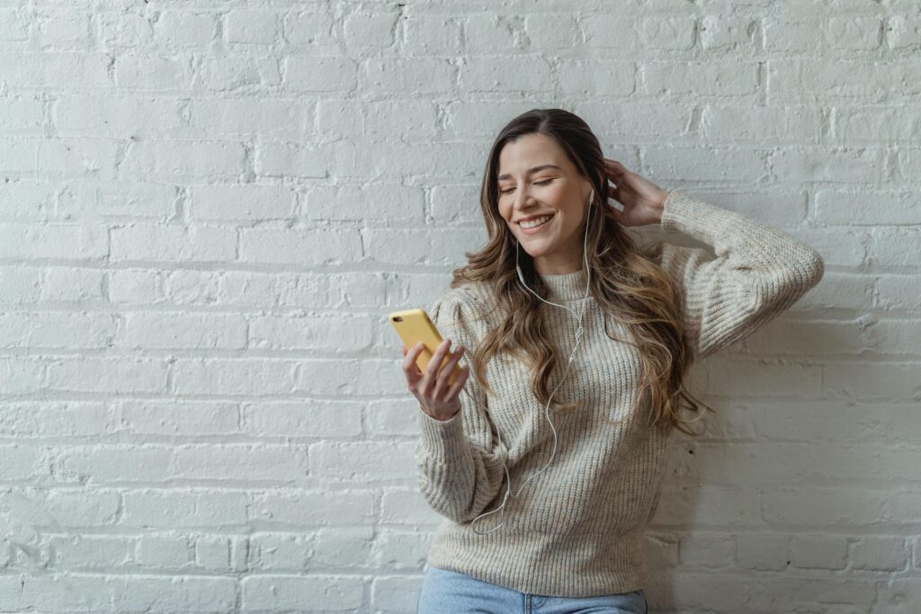 young woman having a video chat on Zepeel using her smartphone 