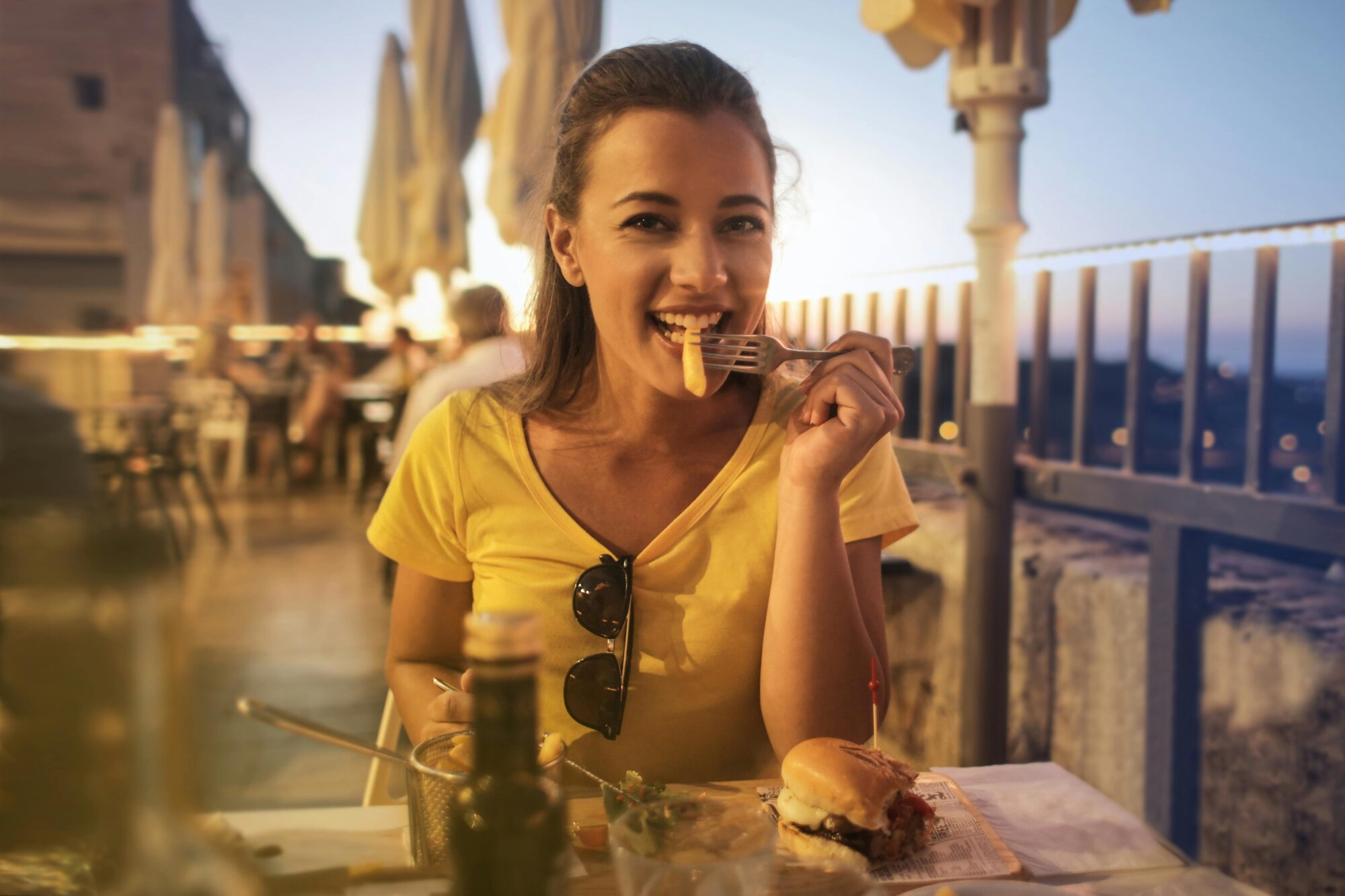 Woman in yellow crew neck t shirt relaxed on a date she found on Zepeel video dating app