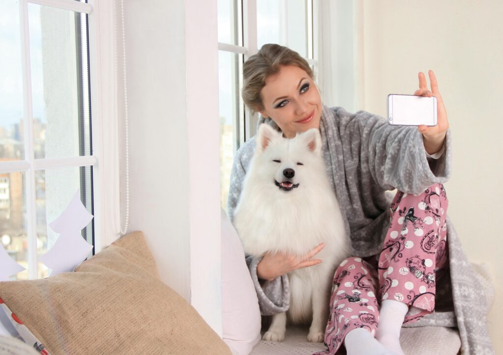 Woman taking a photo of herself with her dog on Zepeel